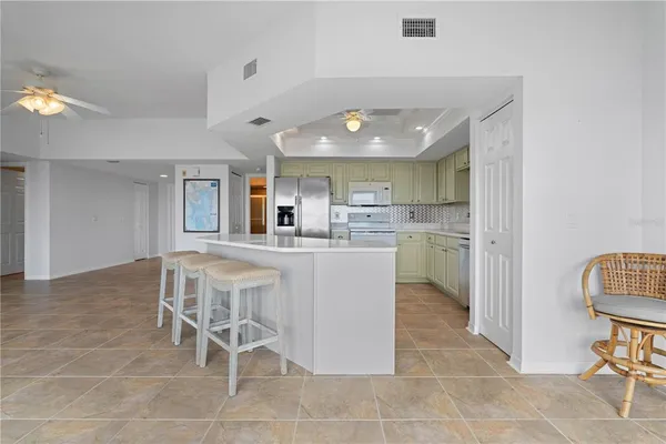 a kitchen with kitchen island cabinets and counter space