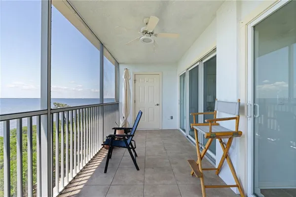a view of a hallway with furniture and entryway