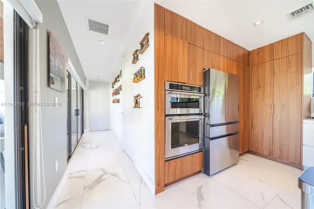 a living room with a couch a large window with outer view