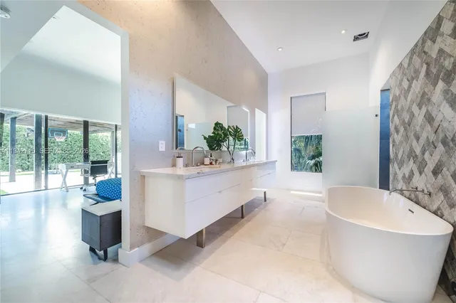 a bathroom with a bathtub and shower