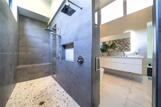a bathroom with a bathtub and a shower