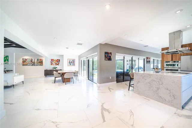 a view of work space with furniture and window