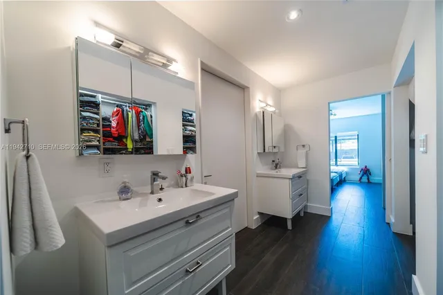 a bathroom with a toilet a sink and a window