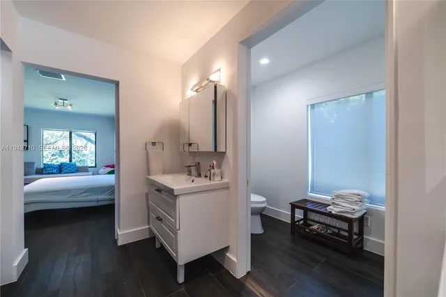 a bathroom with a shower and a sink
