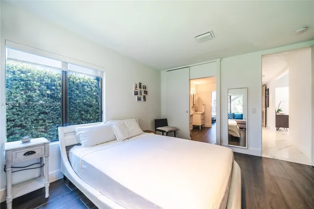 a view of a swimming pool with furniture