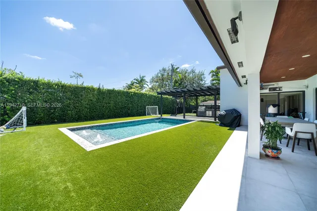 a view of a swimming pool with a porch