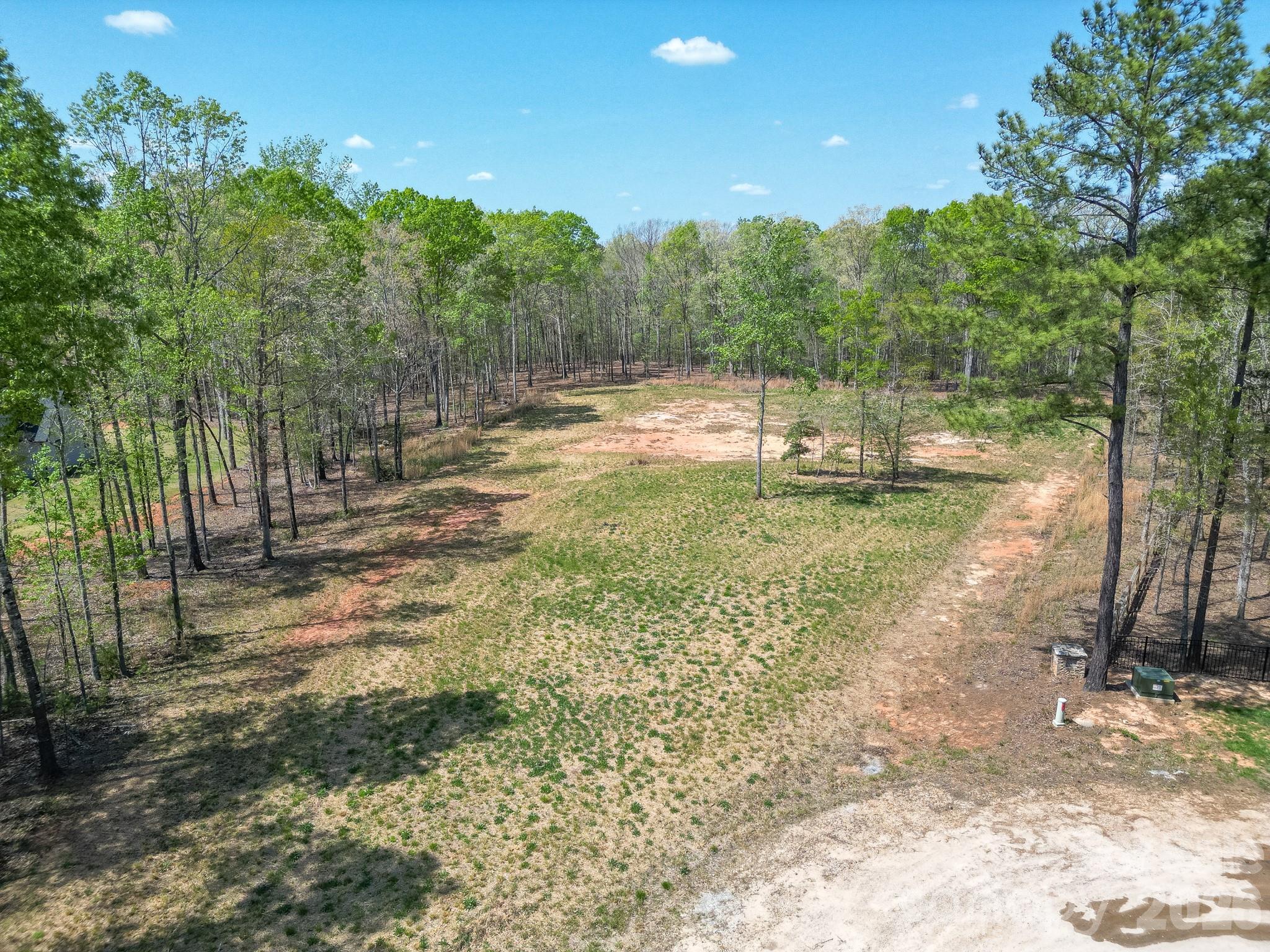 2170 Two Sisters Drive Lancaster, SC 29720 - Photo 11 of 35 a view of a yard with trees in the background