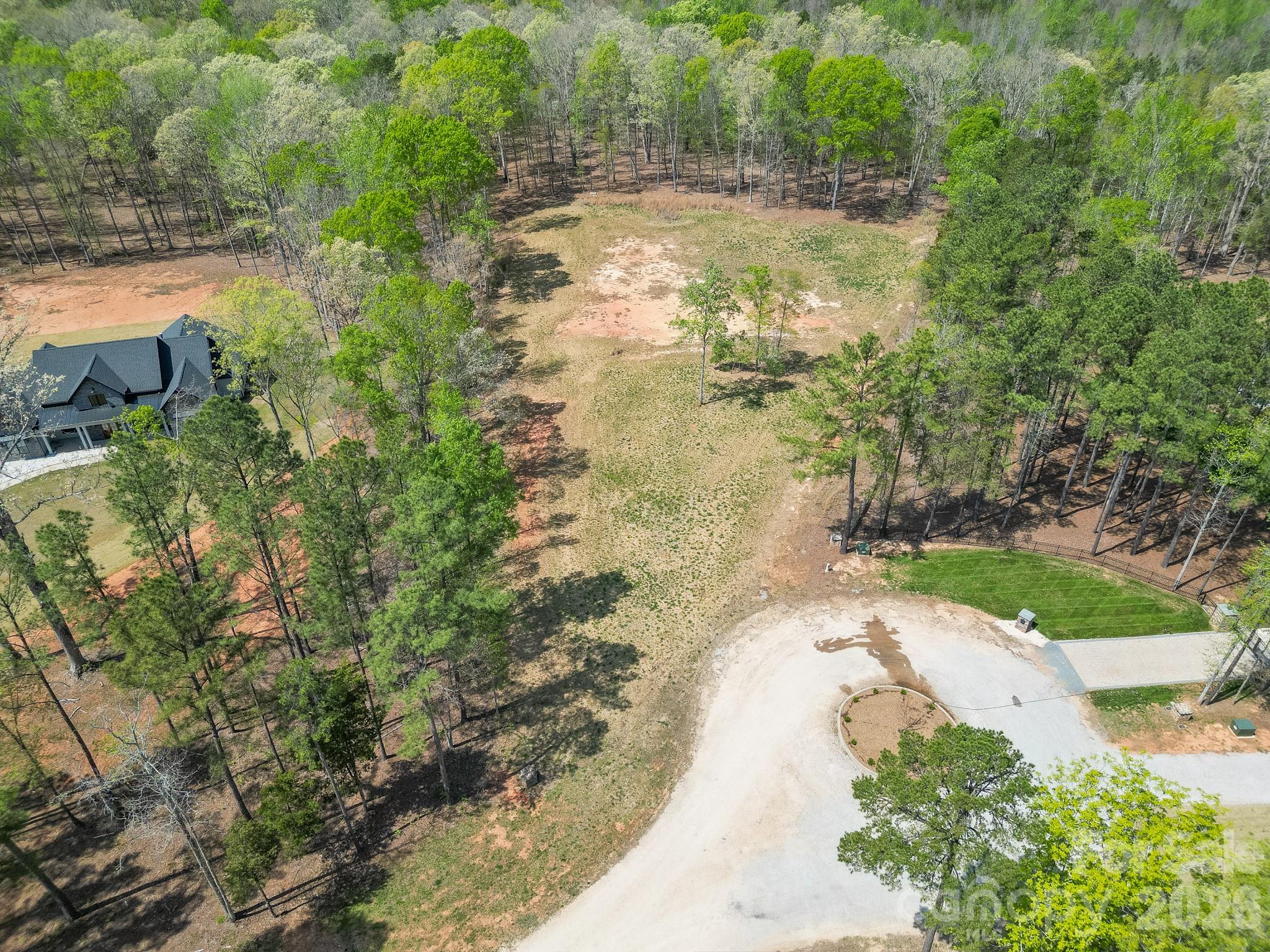 2170 Two Sisters Drive Lancaster, SC 29720 - Photo 14 of 35 a view of a yard with plants and large trees