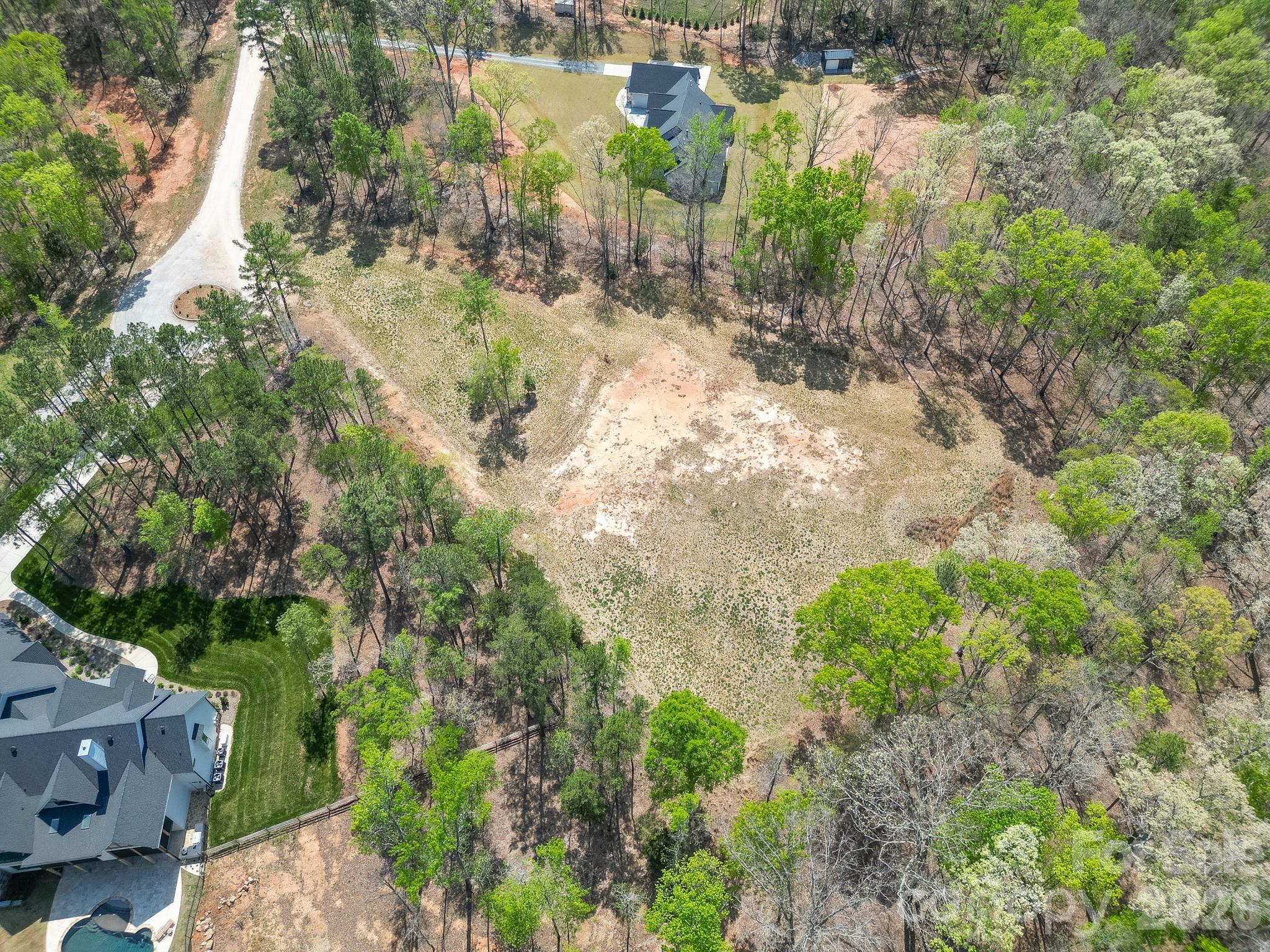 2170 Two Sisters Drive Lancaster, SC 29720 - Photo 21 of 35 a view of a yard with plants and large trees