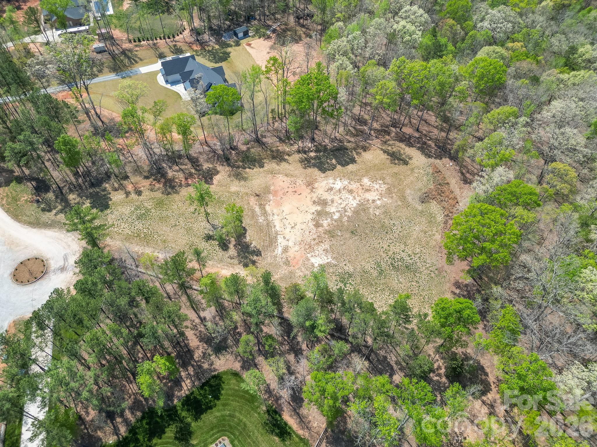 2170 Two Sisters Drive Lancaster, SC 29720 - Photo 22 of 35 a view of a yard with plants and large trees