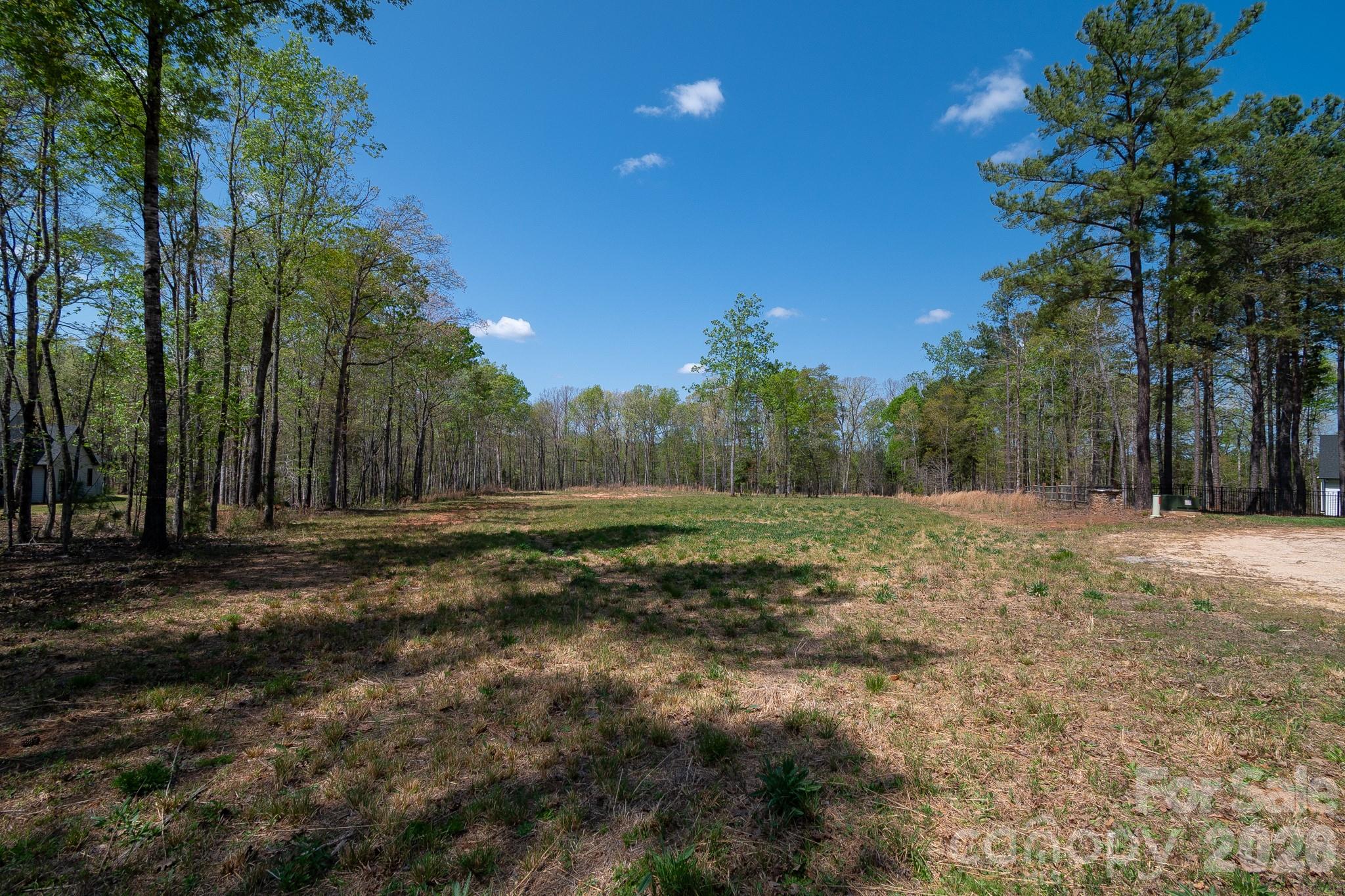 2170 Two Sisters Drive Lancaster, SC 29720 - Photo 5 of 35 a view of a field with trees in the background