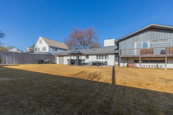 a house with swimming pool in front of it