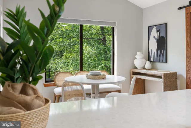 a view of a backyard with table and chairs