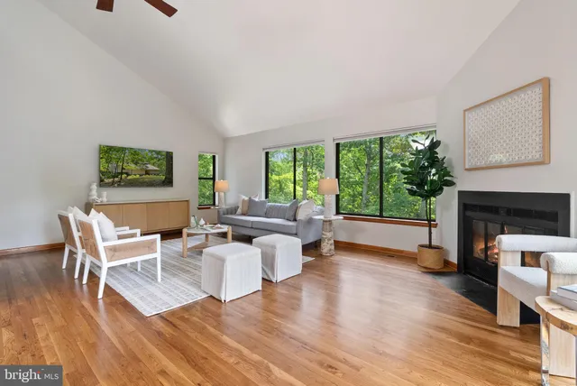 a kitchen with granite countertop a sink and dishwasher a stove with wooden floor