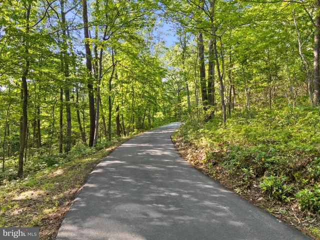 a kitchen with granite countertop a refrigerator stove and sink