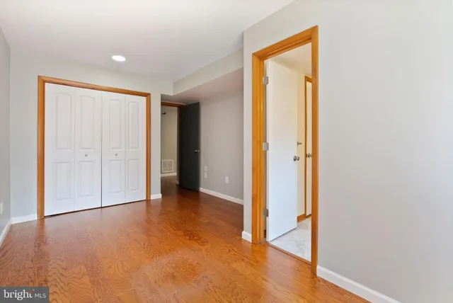 a bathroom with a sink mirror and vanity
