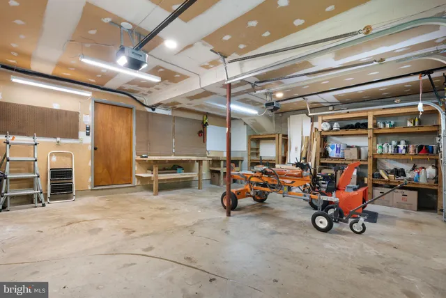 a view of staircase with white walls