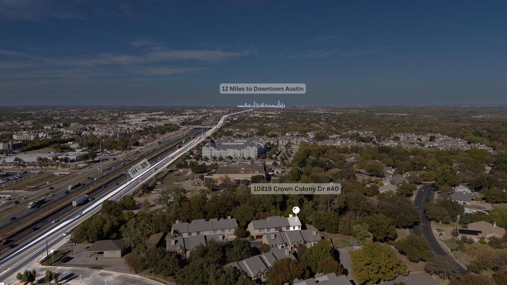 10819 Crown Colony Drive, Unit 40 Austin, TX 78747 - Photo 27 of 38 Aerial view of property and surrounding area featuring a highway