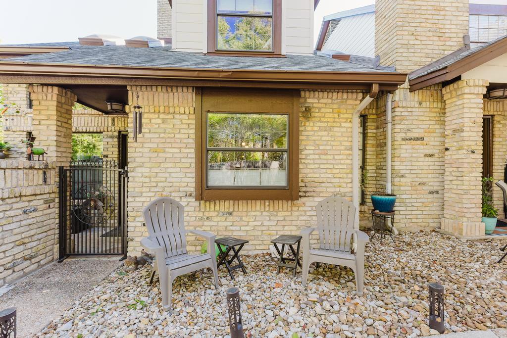 10819 Crown Colony Drive, Unit 40 Austin, TX 78747 - Photo 3 of 38 View of patio featuring a gate