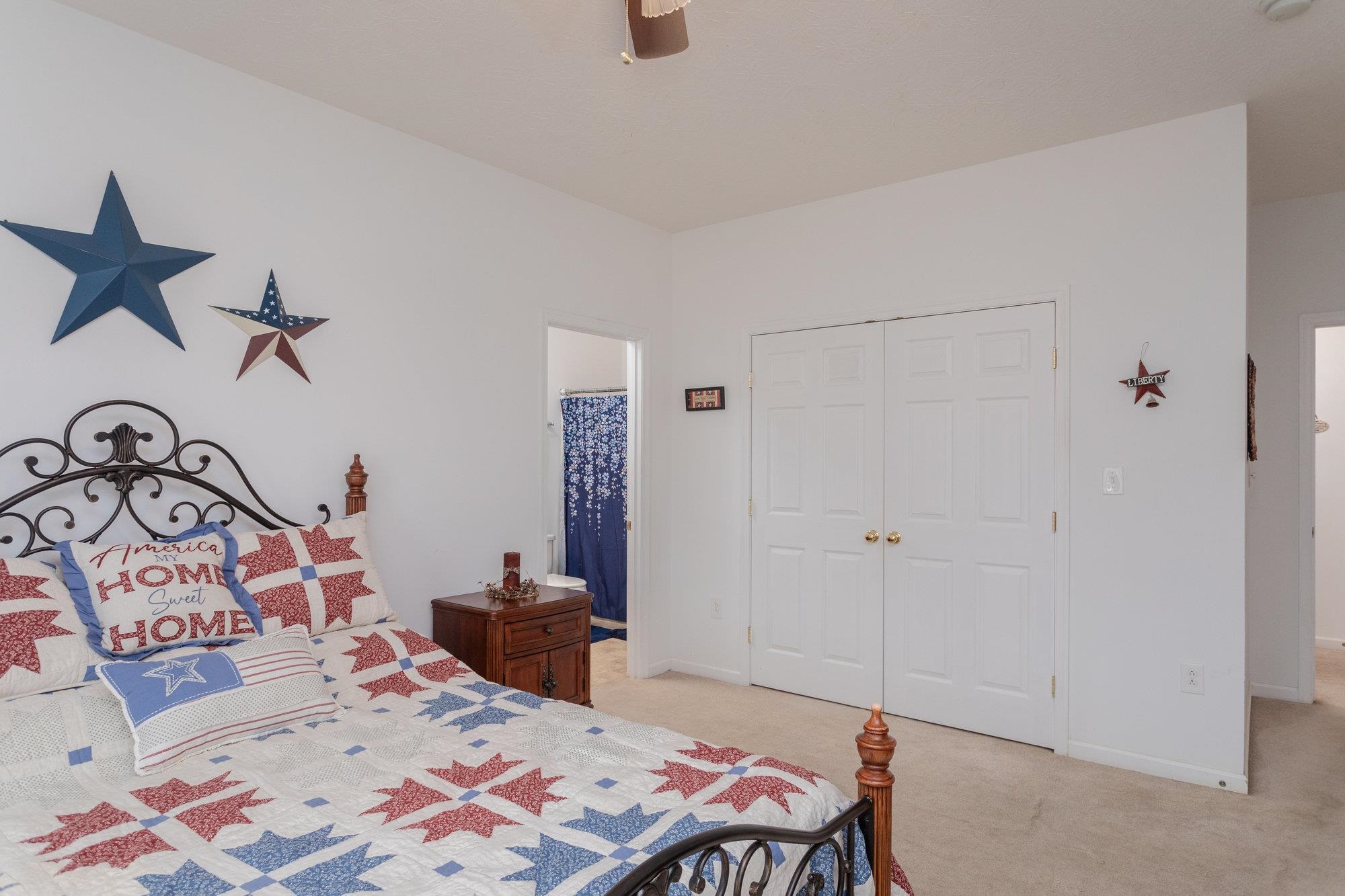 490 Leola Loop Stanley, VA 22851 - Photo 19 of 44 a bedroom with a bed and a chandelier