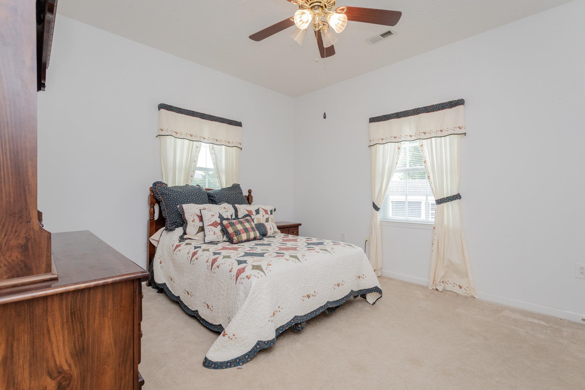 490 Leola Loop Stanley, VA 22851 - Photo 23 of 44 a bed room with a bed and a chandelier