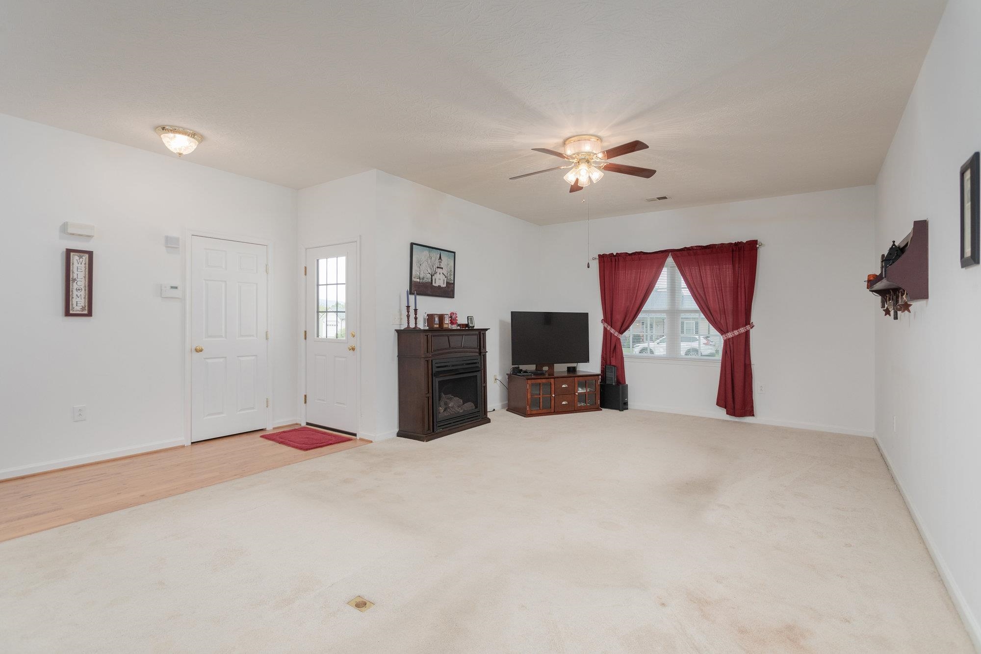 490 Leola Loop Stanley, VA 22851 - Photo 3 of 44 an empty room with chandelier fan and windows