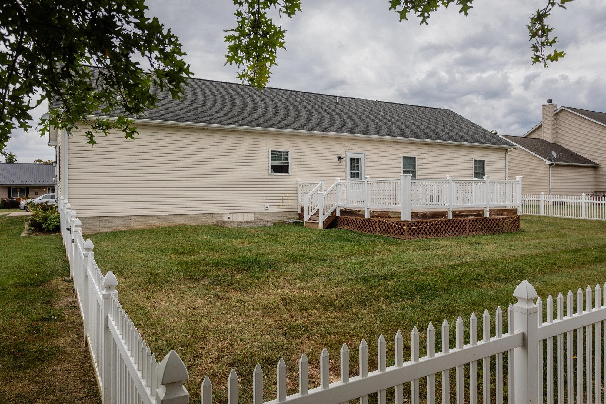 490 Leola Loop Stanley, VA 22851 - Photo 35 of 44 a backyard of a house with wooden fence and trees