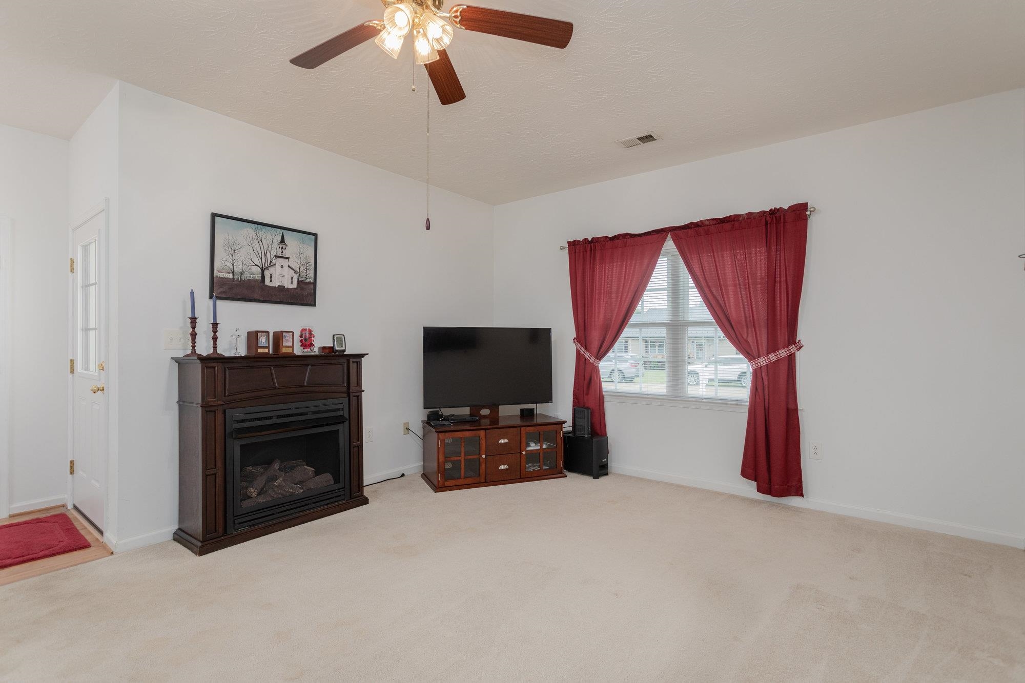 490 Leola Loop Stanley, VA 22851 - Photo 4 of 44 a living room with furniture and a flat screen tv