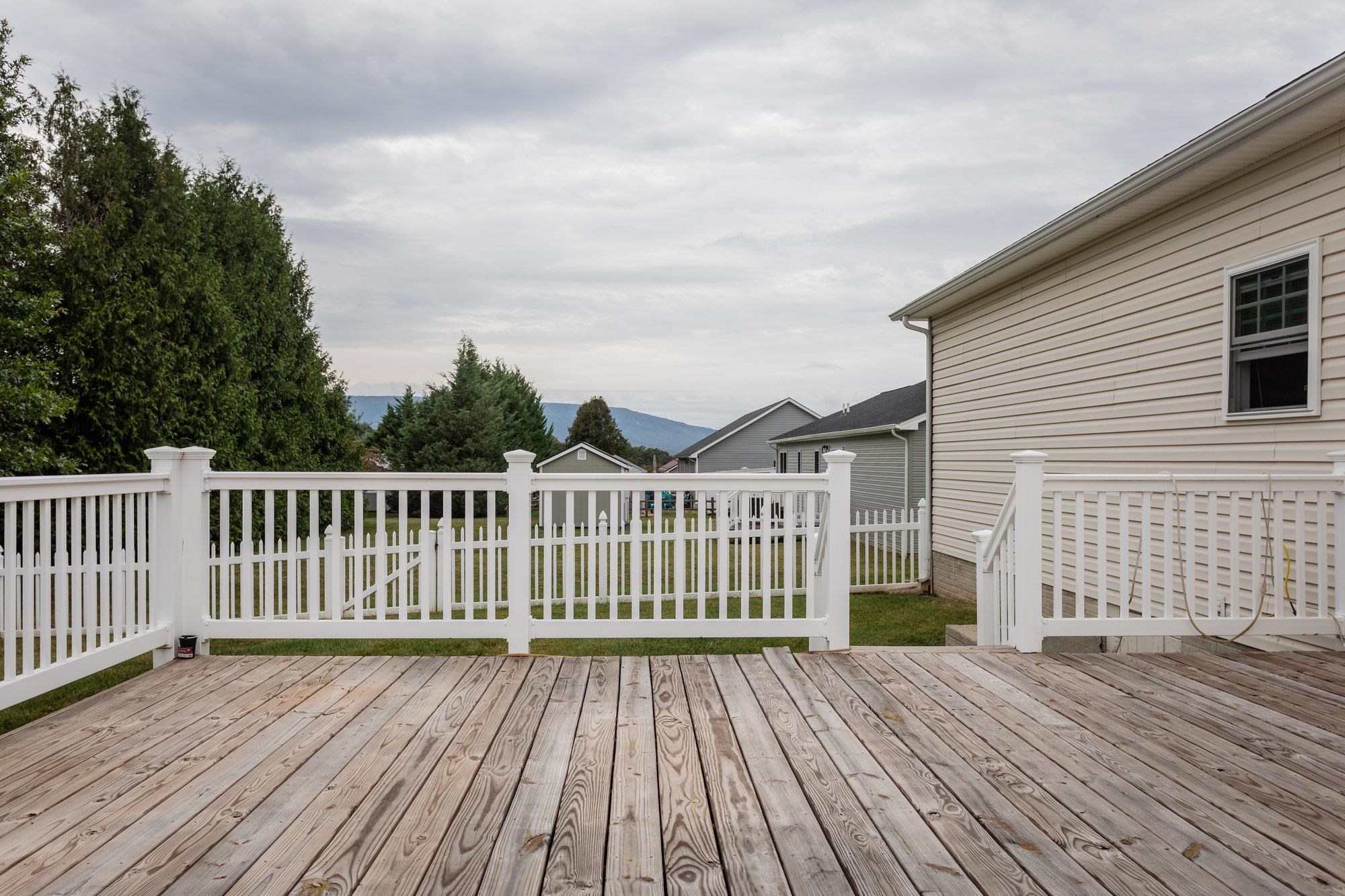 490 Leola Loop Stanley, VA 22851 - Photo 42 of 44 a view of a wooden deck with a yard