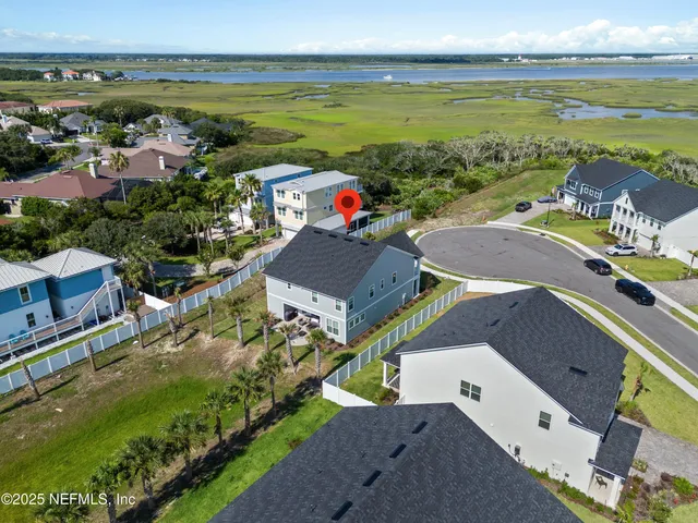 an aerial view of a house with a garden