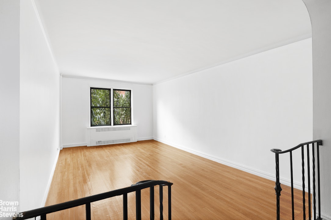 55 East 190th Street, Unit 41 Bronx, NY 10468 - Photo 2 of 8 a view of a hallway with wooden floor and a window
