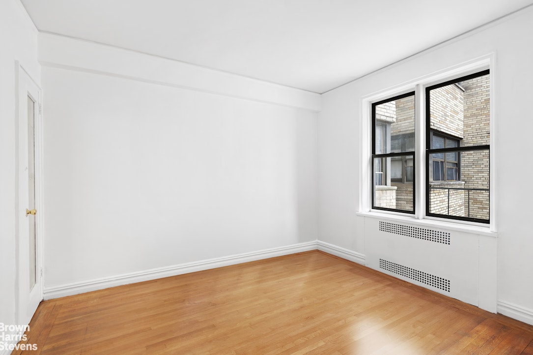 55 East 190th Street, Unit 41 Bronx, NY 10468 - Photo 7 of 8 an empty room with a window