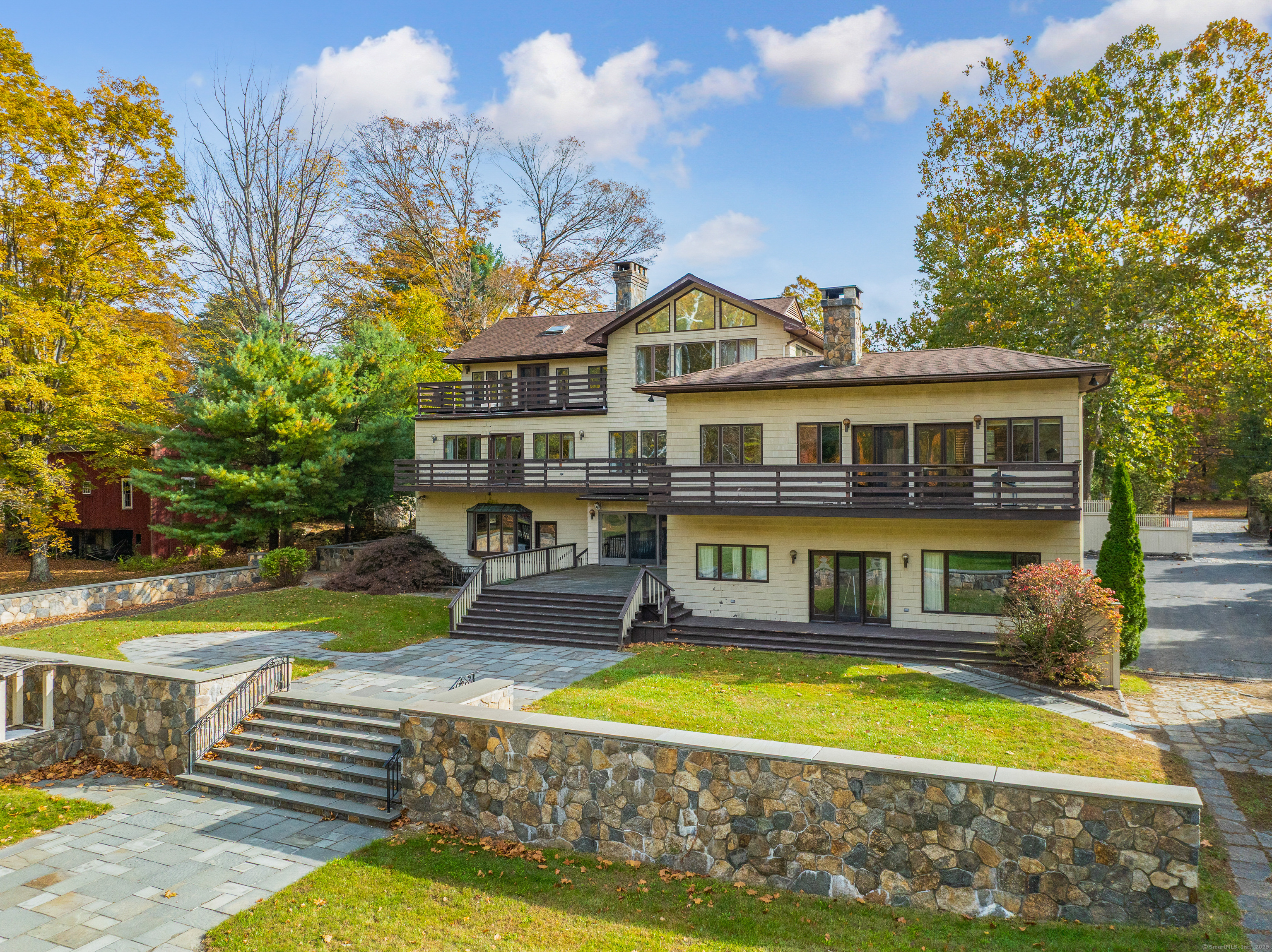262 Lyons Plain Road Weston, CT 06883 - Photo 4 of 14 a front view of a house with swimming pool