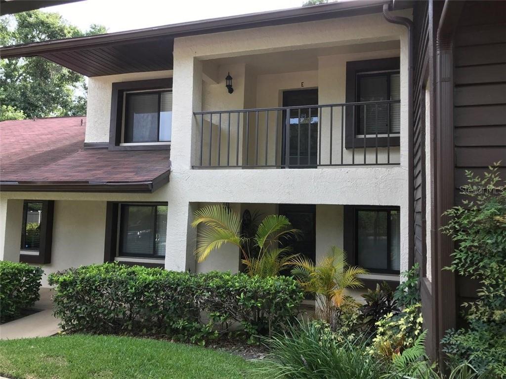 3585 Magnolia Ridge Circle, Unit 721 Palm Harbor, FL 34684 - Photo 1 of 1 front view of a house with a small porch