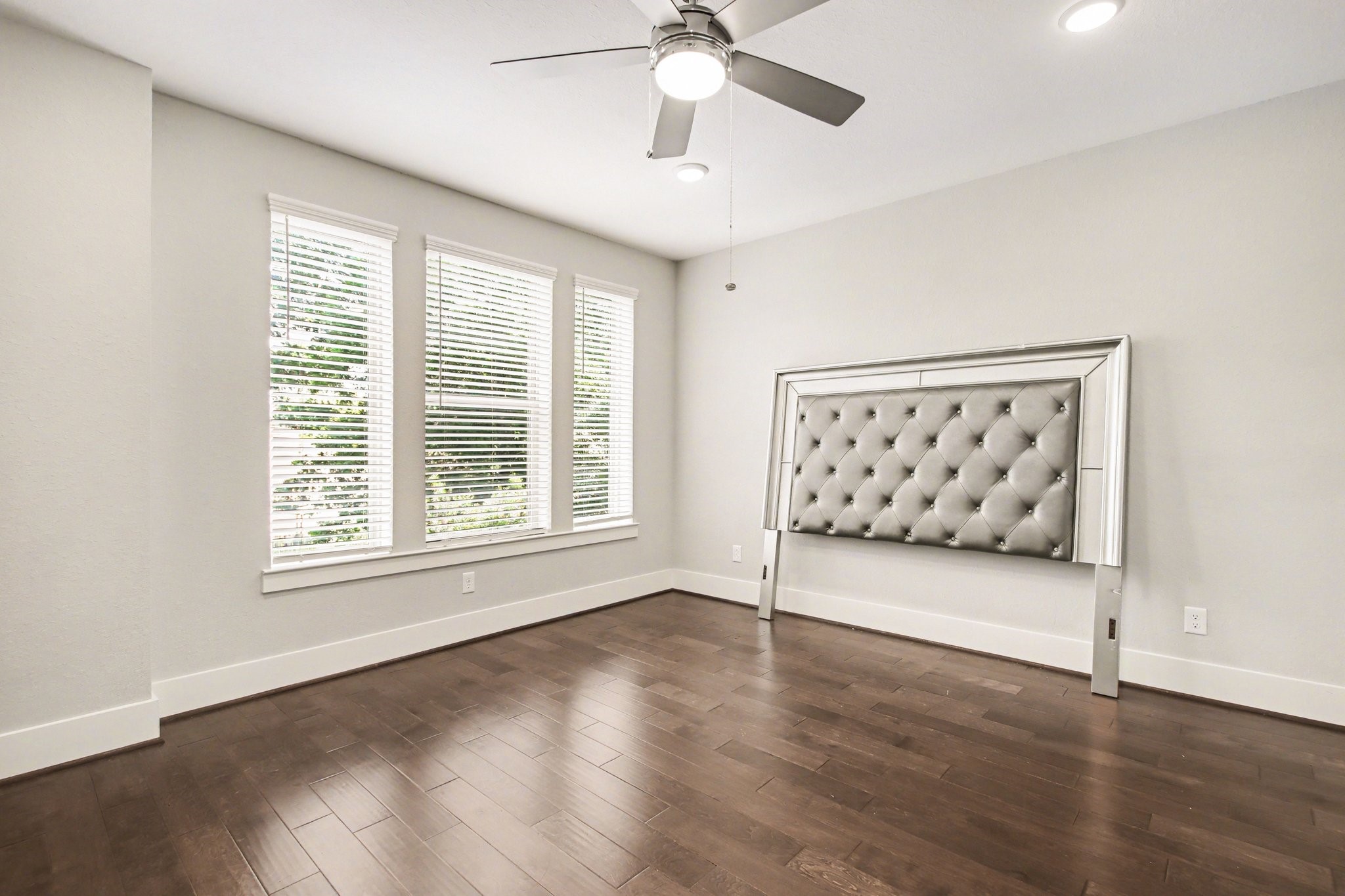 2007 Tarfite Place Houston, TX 77077 - Photo 12 of 24 a view of an empty room with a window and wooden floor