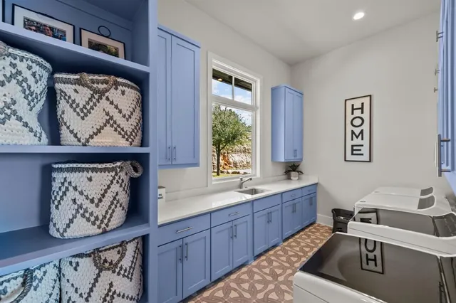 a bed sitting in a spacious bedroom next to a window