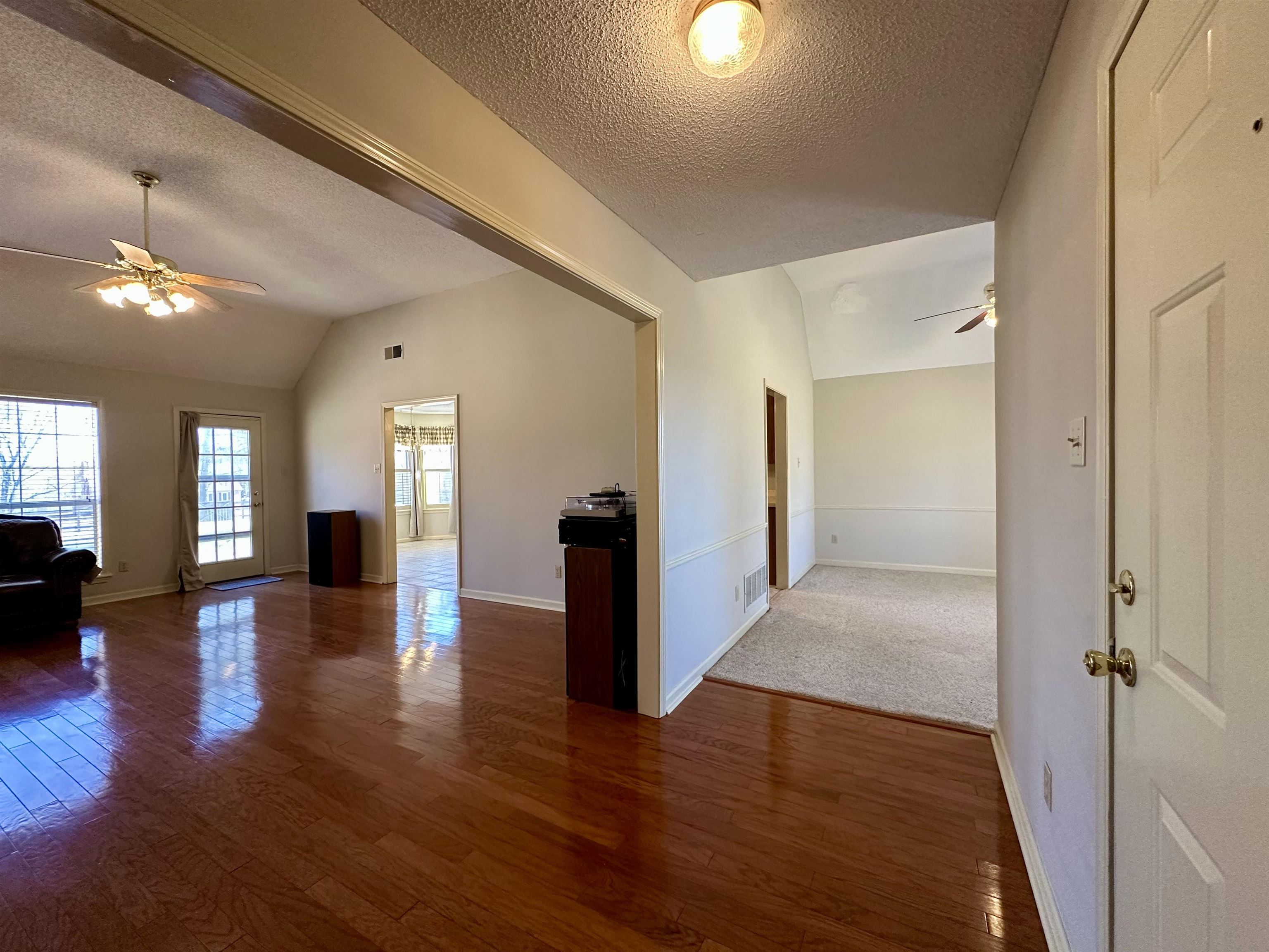 3365 Tomlin Road Somerville, TN 38068 - Photo 6 of 35 Unfurnished living room with ceiling fan and dark wood-style flooring