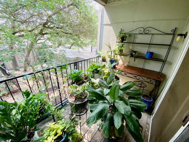 a swimming pool view with a seating space and garden