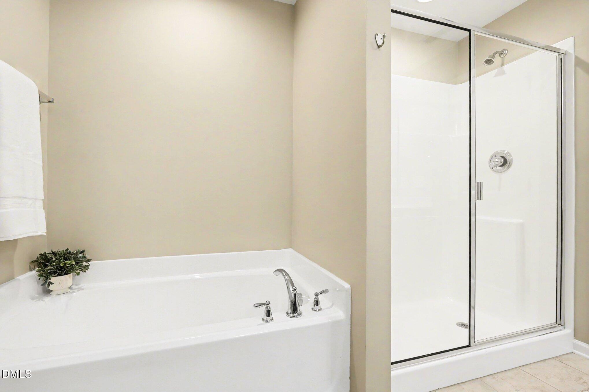 2409 Memory Ridge Drive Raleigh, NC 27606 - Photo 19 of 36 a bathroom with a bathtub