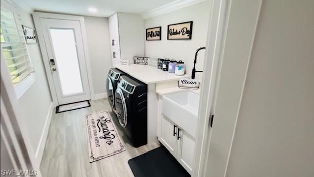 2672 Gulfview Drive Naples, FL 34112 - Photo 6 of 13 a utility room with wooden floor washer and dryer