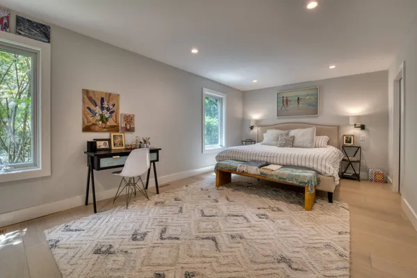 a bedroom with a bed and a desk