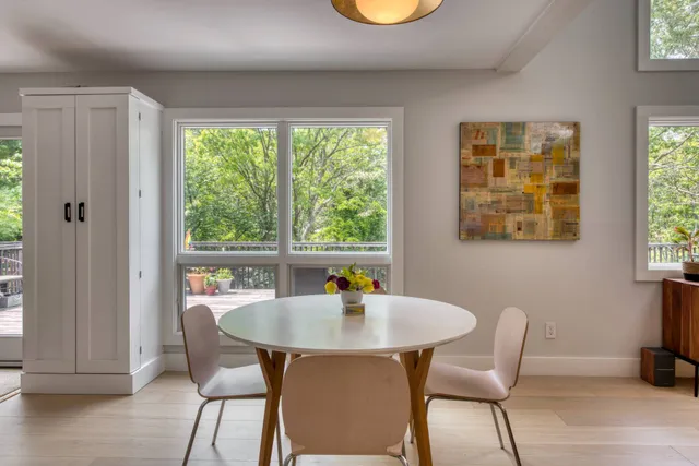 a dining room with furniture and window