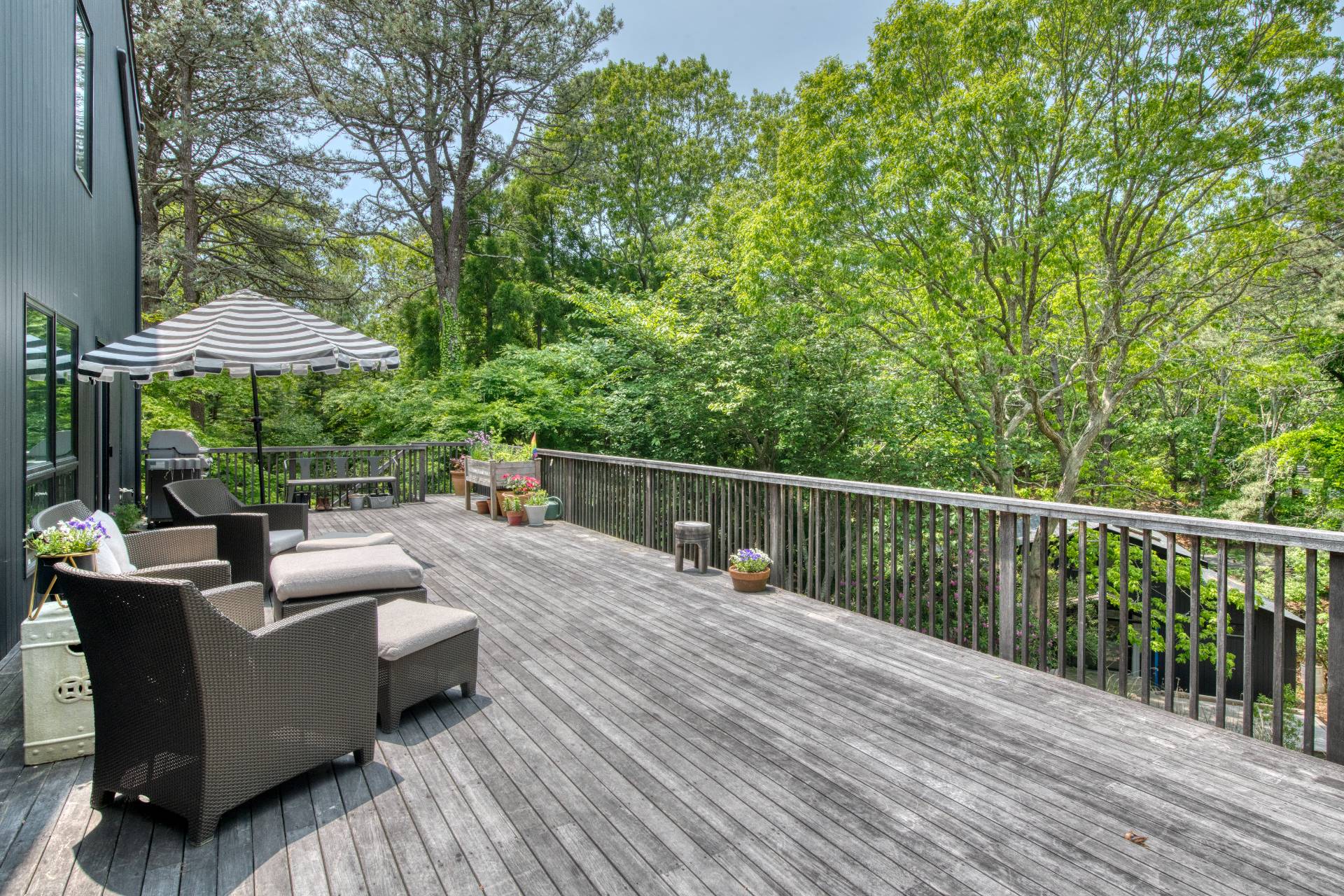 12 Deep View Court East Hampton, NY 11937 - Photo 10 of 20 a view of a deck with furniture and wooden floor