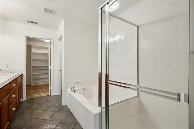a bathroom with a sink double vanity and a mirror