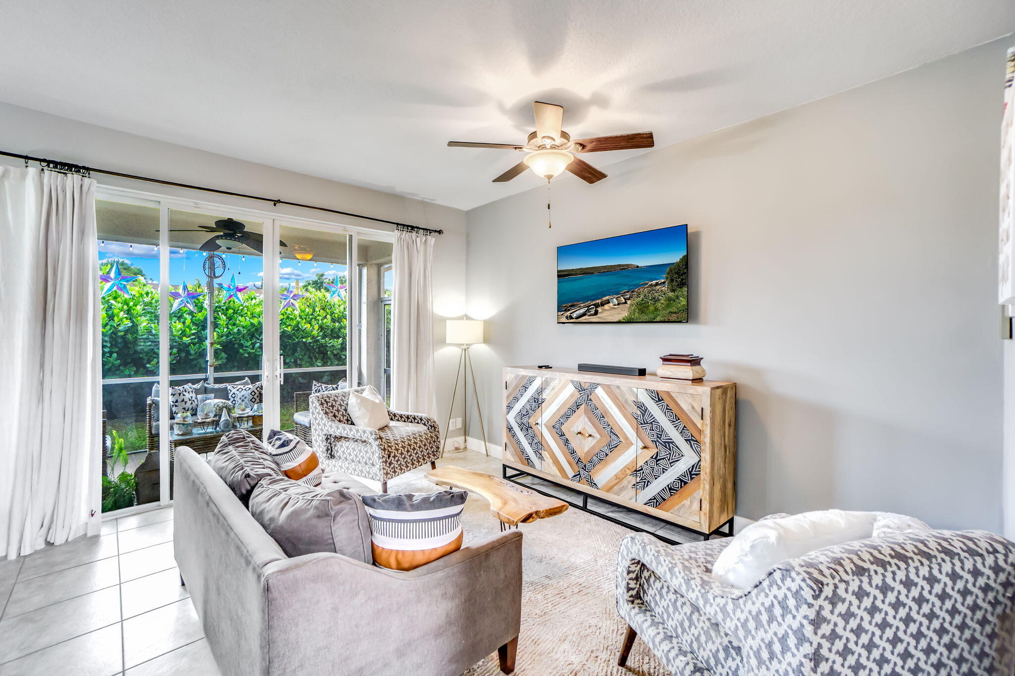 9760 Vineyard Court Boca Raton, FL 33428 - Photo 14 of 75 a living room with furniture and a large window