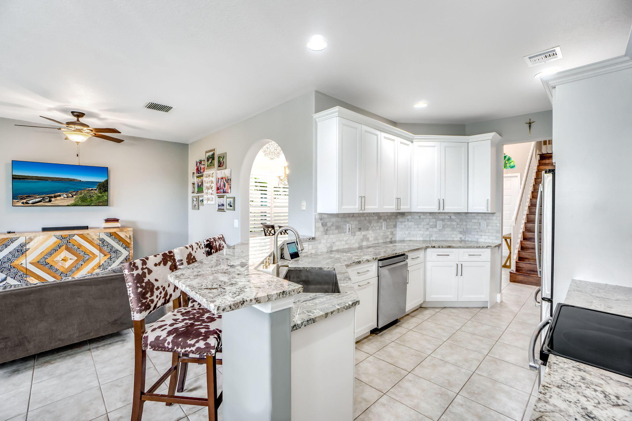 9760 Vineyard Court Boca Raton, FL 33428 - Photo 25 of 75 a kitchen with stainless steel appliances granite countertop a sink and a refrigerator