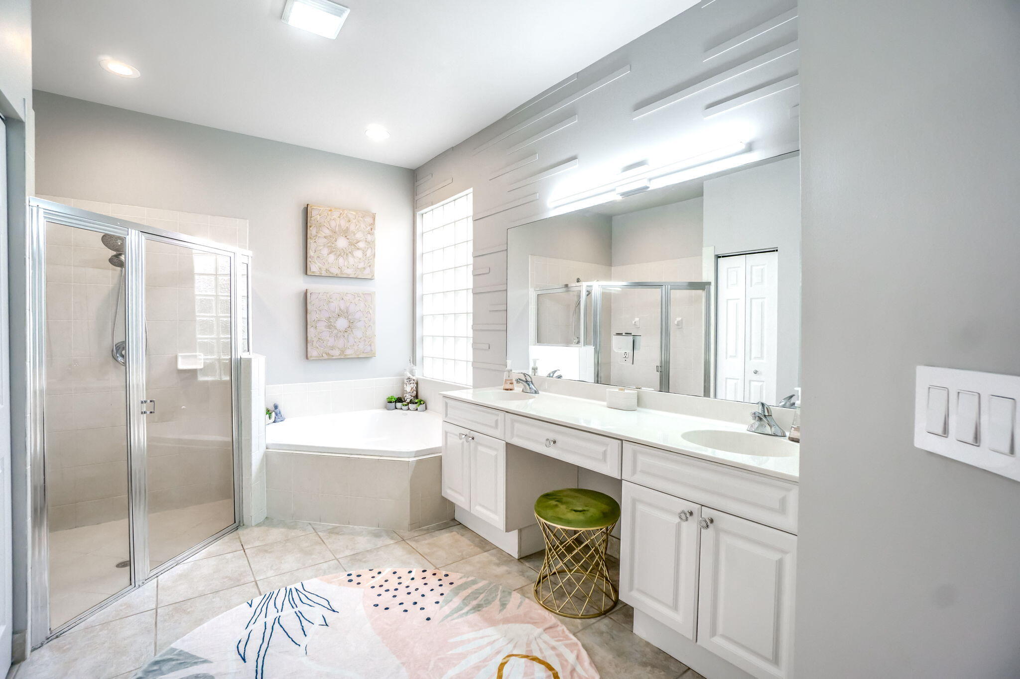 9760 Vineyard Court Boca Raton, FL 33428 - Photo 34 of 75 a spacious bathroom with a granite countertop sink mirror and a bathtub