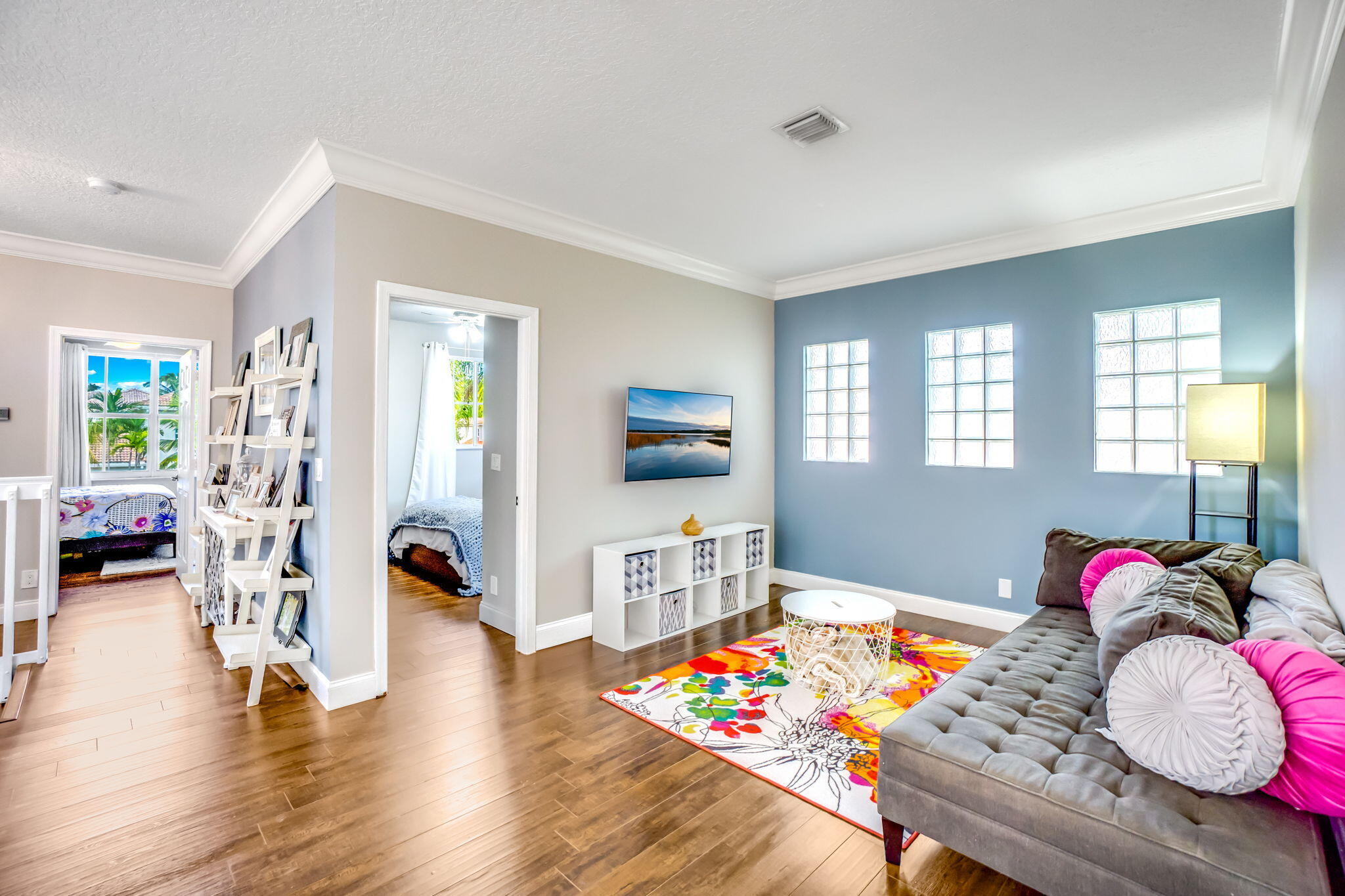 9760 Vineyard Court Boca Raton, FL 33428 - Photo 40 of 75 a living room with furniture and a wooden floor