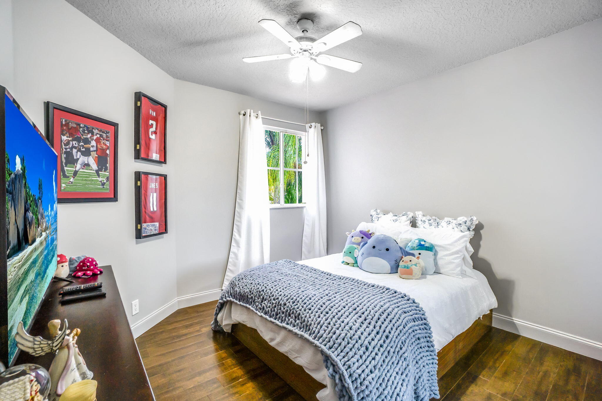 9760 Vineyard Court Boca Raton, FL 33428 - Photo 45 of 75 a bedroom with a bed and a chandelier
