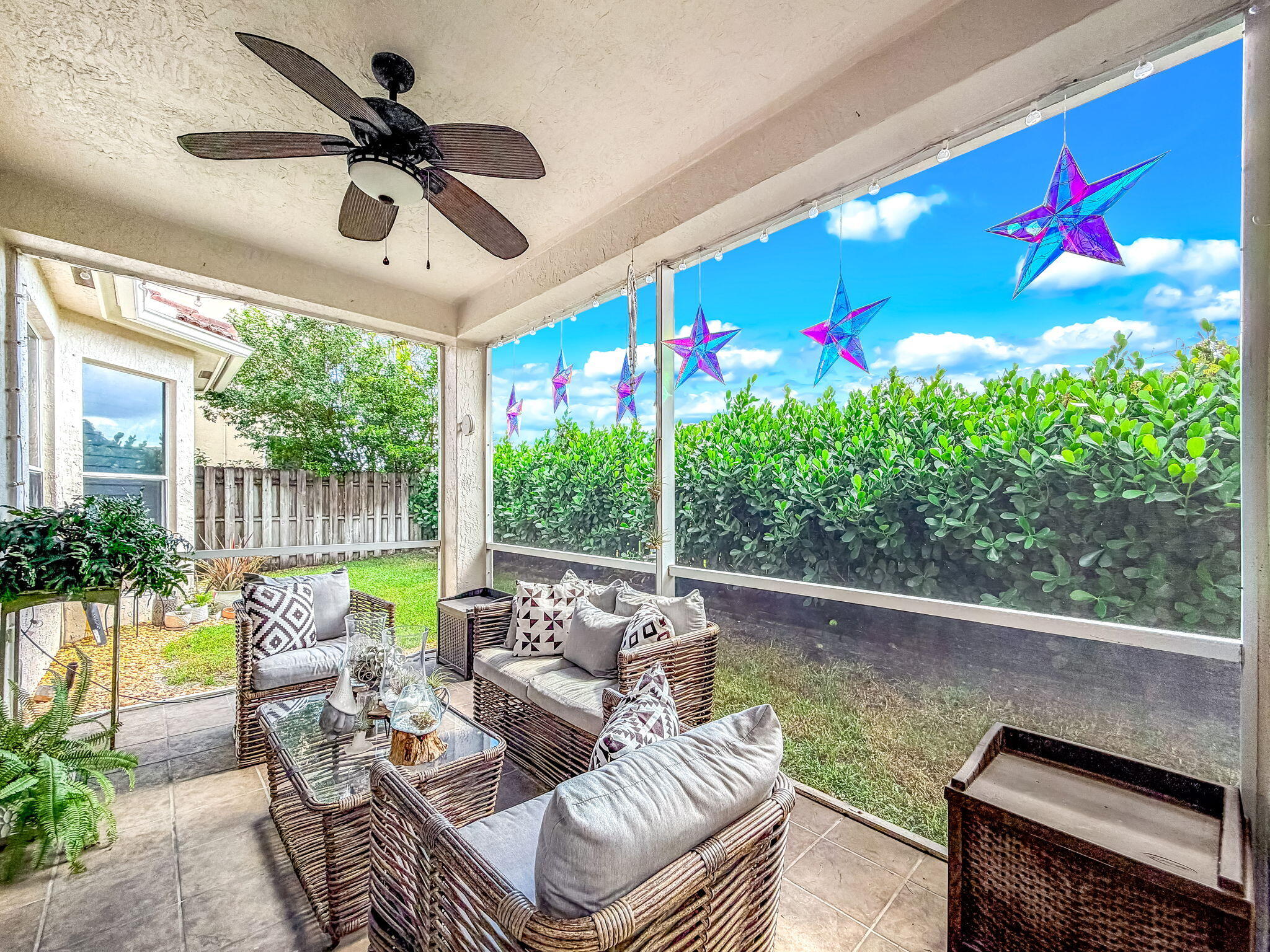 9760 Vineyard Court Boca Raton, FL 33428 - Photo 49 of 75 a living room with patio furniture and a potted plant